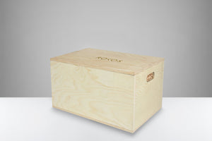 Wooden gift box packed with wood shavings