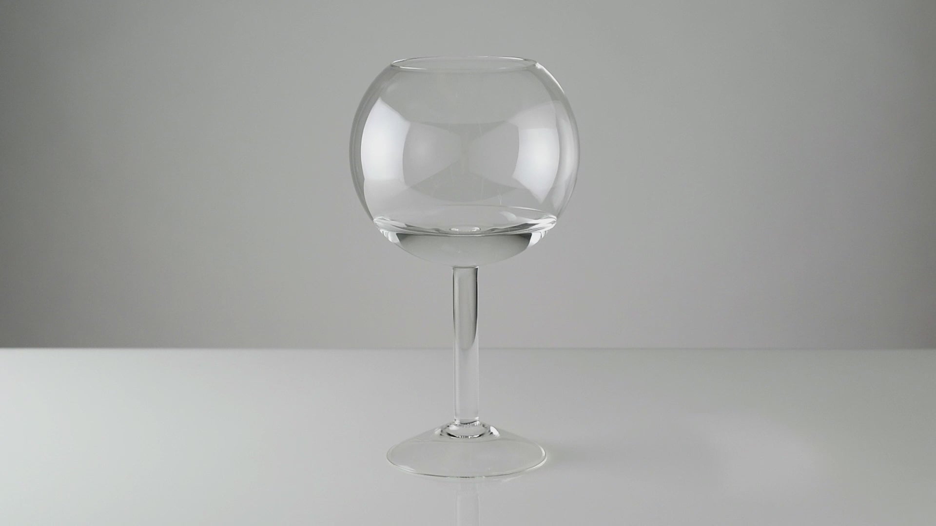 A time lapse film of a candle being inserted into a glass candleholder containing water and lit. As the floating candle burns down the lower part rises up until it reaches a wider part in the glass. At this point it is no longer supported and it capsizes, extinguishing itself in the water. 