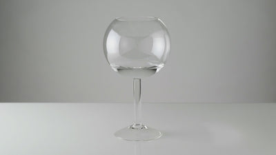 A time lapse film of a candle being inserted into a glass candleholder containing water and lit. As the floating candle burns down the lower part rises up until it reaches a wider part in the glass. At this point it is no longer supported and it capsizes, extinguishing itself in the water. 